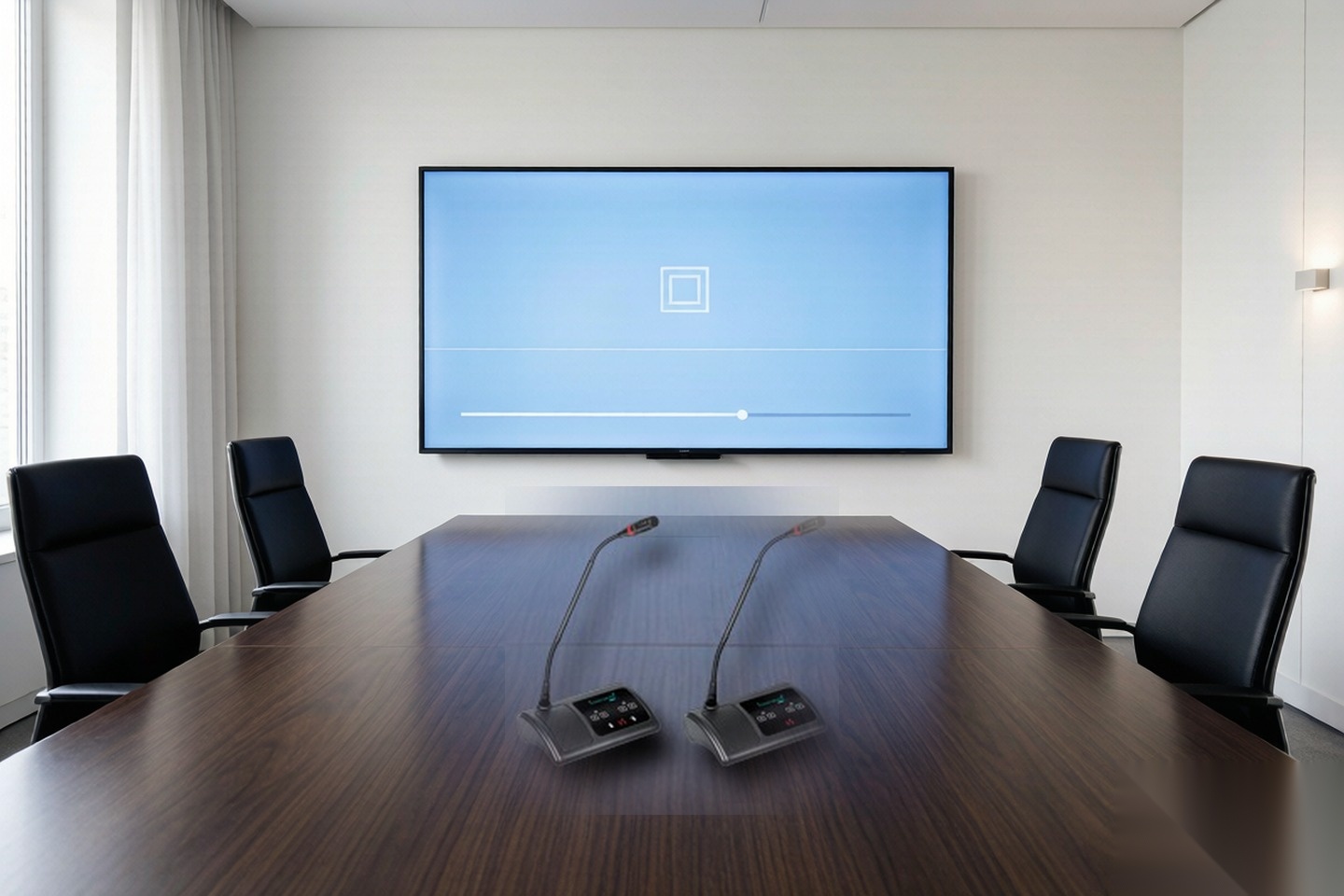 Gooseneck conference microphones on a meeting table