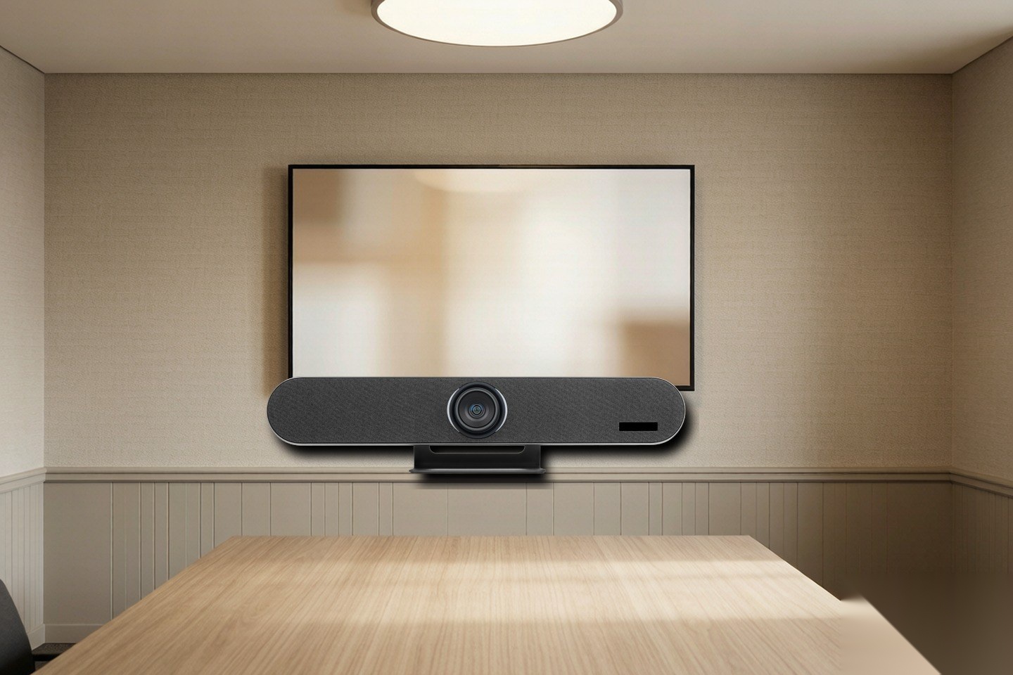 GB100 all-in-one videobar mounted below a meeting room display